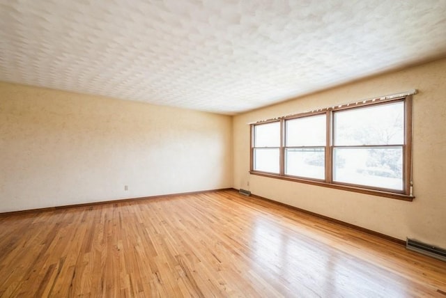 2029 Knollshire Rd NE, Cedar Rapids, IA 52402 - unfurnished room featuring light wood-type flooring and baseboards