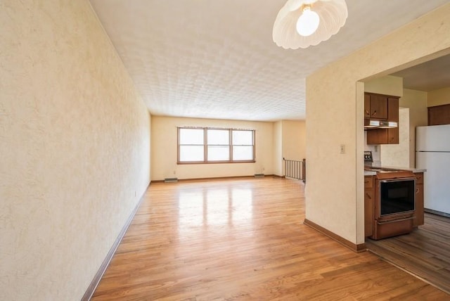 2029 Knollshire Rd NE, Cedar Rapids, IA 52402 - unfurnished living room featuring light wood finished floors and ceiling fan
