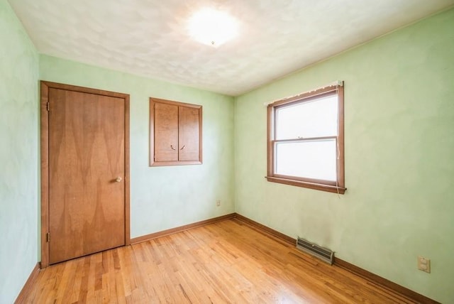 2029 Knollshire Rd NE, Cedar Rapids, IA 52402 - unfurnished bedroom with light wood-type flooring and baseboards