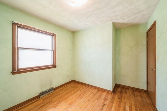 2029 Knollshire Rd NE, Cedar Rapids, IA 52402 - empty room featuring light wood-style floors and baseboards