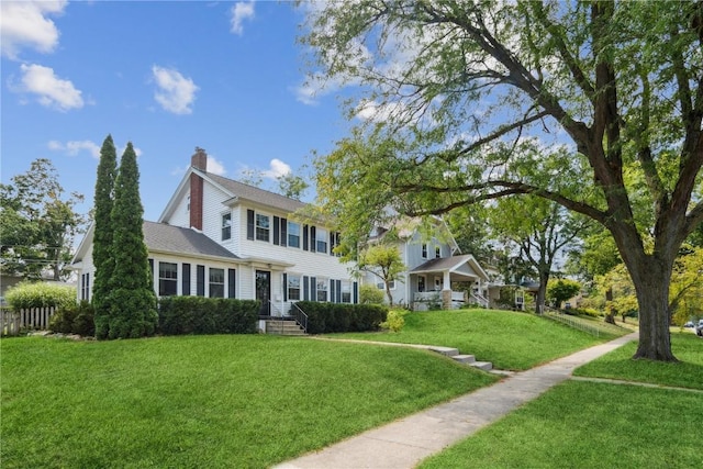 2021 Bever Ave SE, Cedar Rapids, IA 52403 - colonial inspired home with a front lawn and a chimney