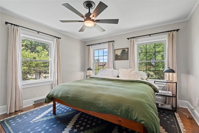 2021 Bever Ave SE, Cedar Rapids, IA 52403 - bedroom featuring wood finished floors, ornamental molding, and ceiling fan