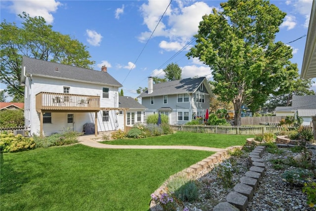 2021 Bever Ave SE, Cedar Rapids, IA 52403 - back of property with a chimney and a deck