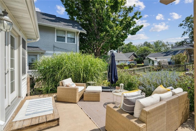 2021 Bever Ave SE, Cedar Rapids, IA 52403 - fenced backyard with outdoor lounge area, a patio area, and a residential view
