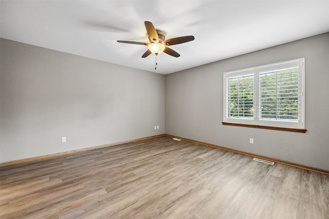 1458 Tower Ln NE Unit 12, Cedar Rapids, IA 52402 - spare room featuring light wood-type flooring and a ceiling fan