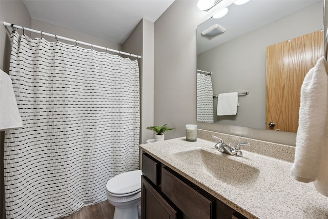 1458 Tower Ln NE Unit 12, Cedar Rapids, IA 52402 - bathroom featuring vanity, wood finished floors, and a shower with curtain