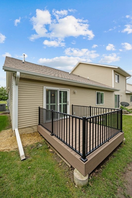1458 Tower Ln NE Unit 12, Cedar Rapids, IA 52402 - rear view of house with a deck and a yard