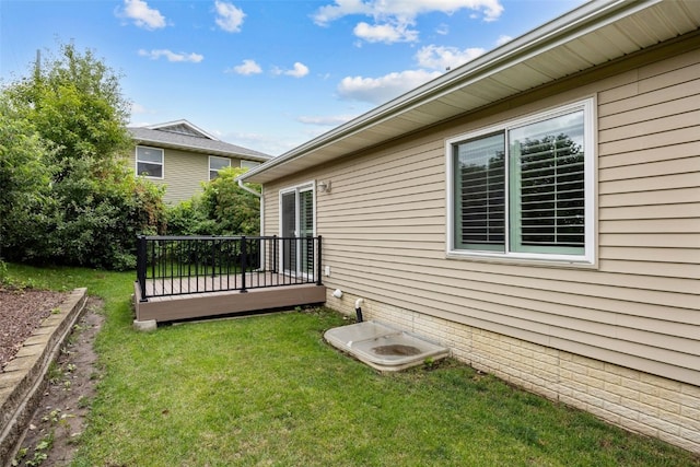 1458 Tower Ln NE Unit 12, Cedar Rapids, IA 52402 - view of green lawn with a deck