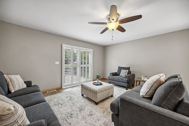 1458 Tower Ln NE Unit 12, Cedar Rapids, IA 52402 - living room featuring wood finished floors and a ceiling fan