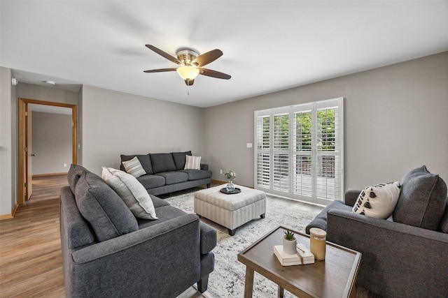 1458 Tower Ln NE Unit 12, Cedar Rapids, IA 52402 - living room with light wood-type flooring and ceiling fan