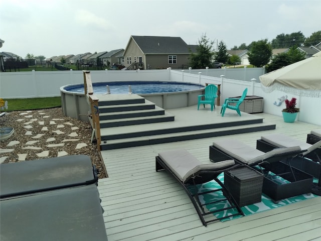 8903 Norway Dr NE, Cedar Rapids, IA 52402 - wooden terrace featuring a fenced backyard and a residential view