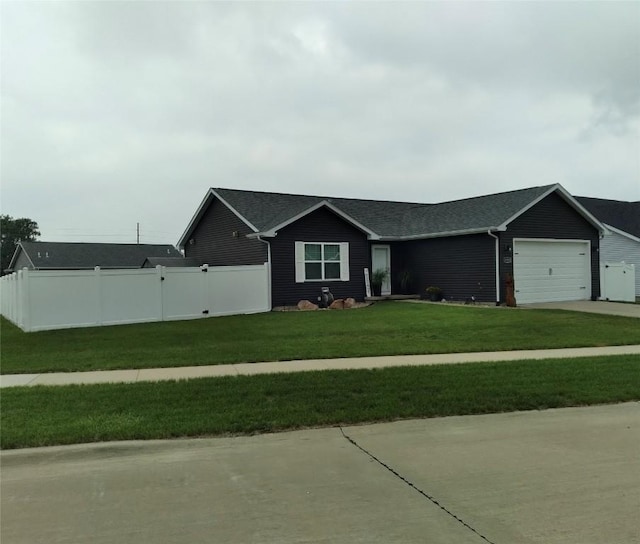 8903 Norway Dr NE, Cedar Rapids, IA 52402 - ranch-style house with an attached garage, concrete driveway, and a shingled roof