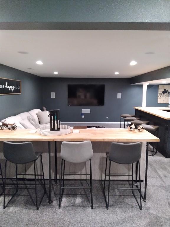 8903 Norway Dr NE, Cedar Rapids, IA 52402 - bar featuring recessed lighting and light colored carpet