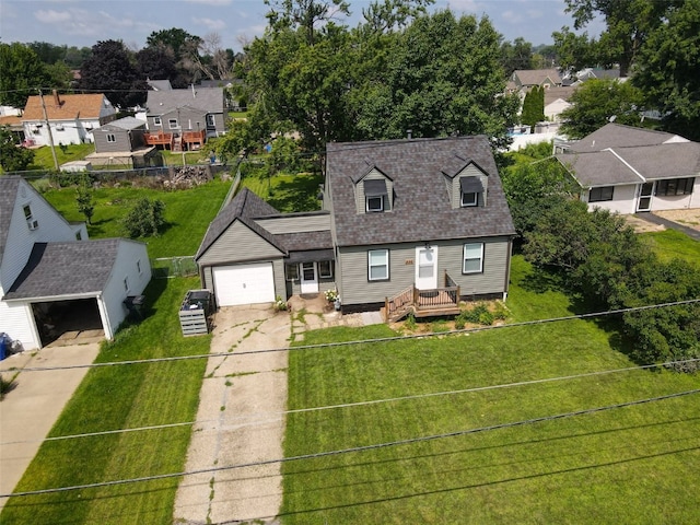 336 20th St NW, Cedar Rapids, IA 52405 - cape cod-style house featuring driveway, a residential view, a garage, and roof with shingles
