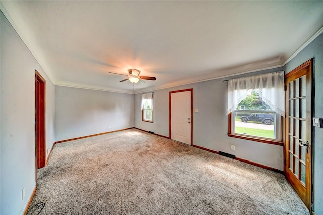 336 20th St NW, Cedar Rapids, IA 52405 - unfurnished room with ornamental molding, carpet floors, and a ceiling fan