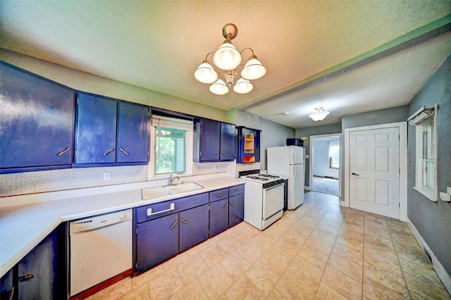 336 20th St NW, Cedar Rapids, IA 52405 - kitchen with white appliances, a chandelier, light countertops, and blue cabinets