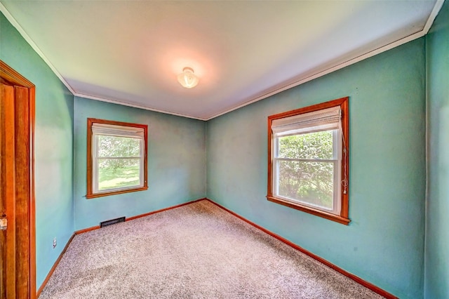336 20th St NW, Cedar Rapids, IA 52405 - empty room featuring healthy amount of natural light, ornamental molding, and carpet