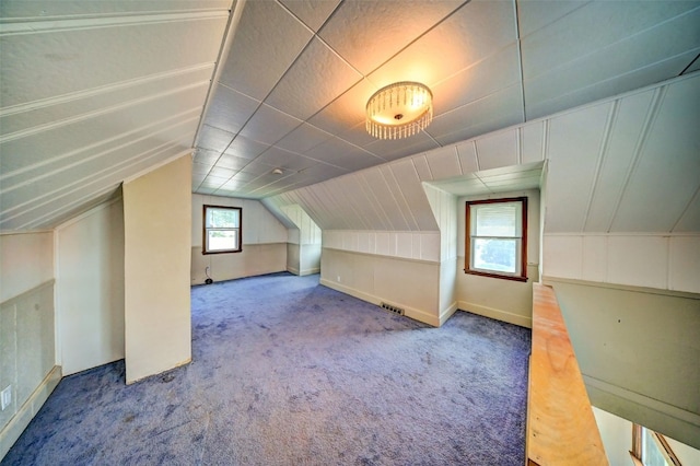 336 20th St NW, Cedar Rapids, IA 52405 - additional living space featuring carpet floors and lofted ceiling