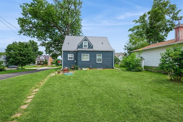 2000 Hamilton St SW, Cedar Rapids, IA 52404 - view of front of house featuring a front lawn and a metal roof