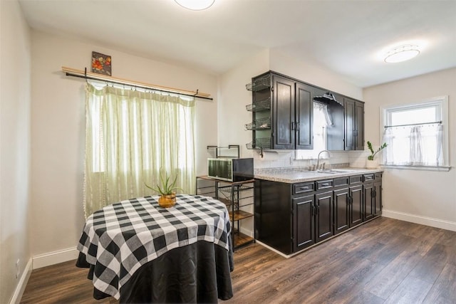 2000 Hamilton St SW, Cedar Rapids, IA 52404 - kitchen featuring dark wood-style floors, light countertops, open shelves, and dark cabinetry