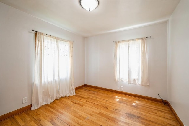 2000 Hamilton St SW, Cedar Rapids, IA 52404 - unfurnished room with baseboards and light wood-style floors