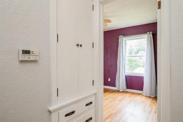 2000 Hamilton St SW, Cedar Rapids, IA 52404 - hall with light wood-type flooring and a textured wall