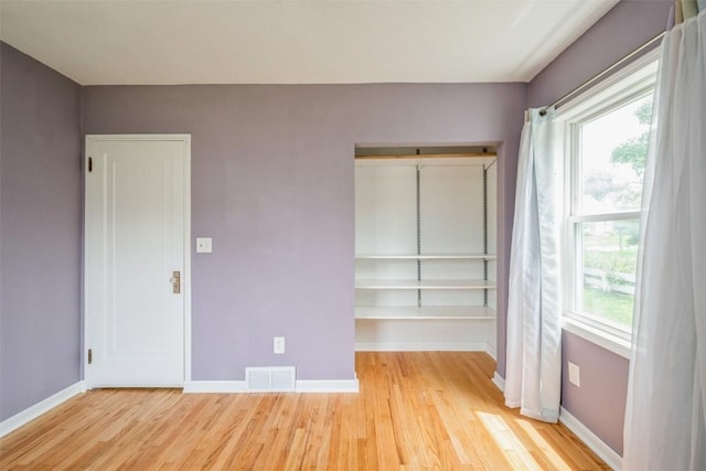 2000 Hamilton St SW, Cedar Rapids, IA 52404 - unfurnished bedroom featuring light wood-style flooring and a closet