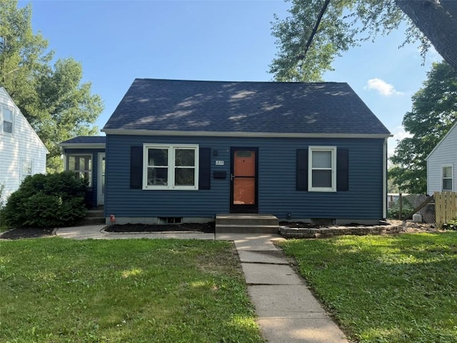 1839 K Ave NE, Cedar Rapids, IA 52402 - view of front facade featuring roof with shingles