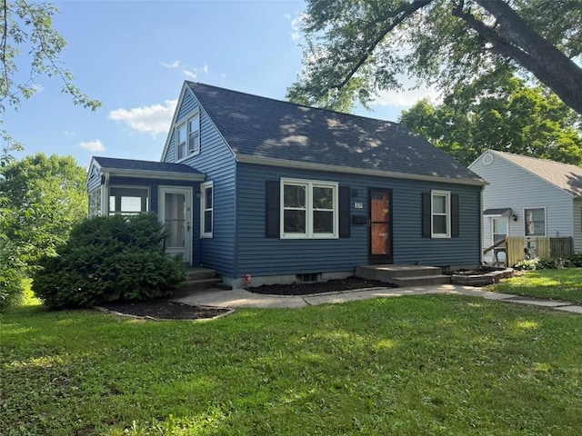 1839 K Ave NE, Cedar Rapids, IA 52402 - cape cod-style house featuring a front lawn and roof with shingles