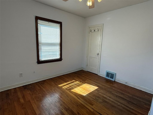 1839 K Ave NE, Cedar Rapids, IA 52402 - unfurnished room featuring hardwood / wood-style floors and a ceiling fan