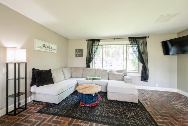 1935 1st Ave SW, Cedar Rapids, IA 52405 - living room with brick flooring and baseboards