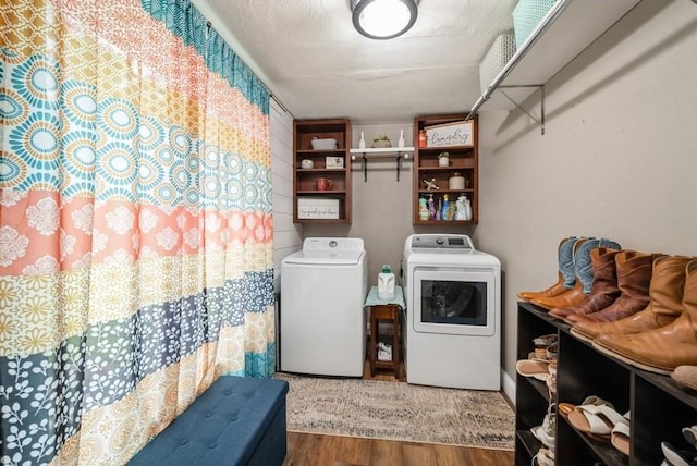 1935 1st Ave SW, Cedar Rapids, IA 52405 - laundry room with washer and clothes dryer and wood finished floors