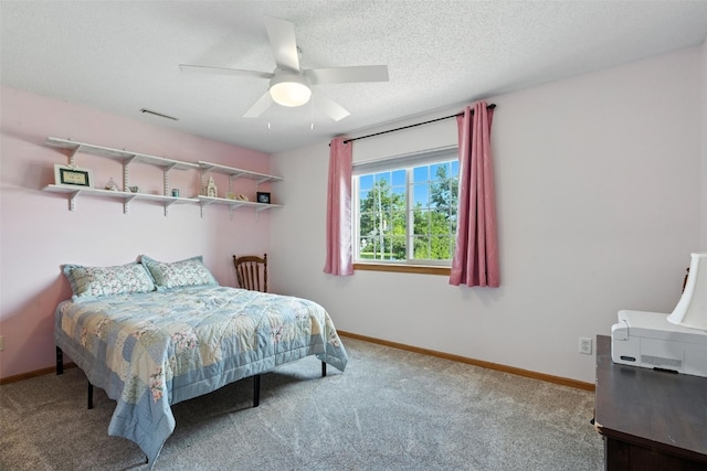 3060 Wilson Ave SW Unit 7, Cedar Rapids, IA 52404 - carpeted bedroom featuring ceiling fan and a textured ceiling