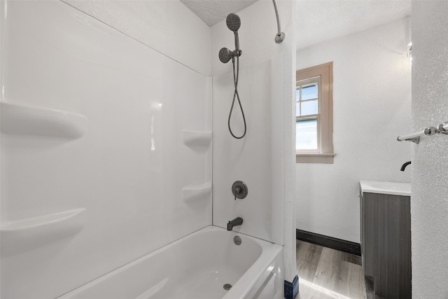 1818 Park Ave SE, Cedar Rapids, IA 52403 - bathroom with shower / tub combination, wood finished floors, and vanity