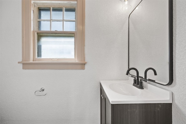 1818 Park Ave SE, Cedar Rapids, IA 52403 - bathroom featuring vanity and a textured wall