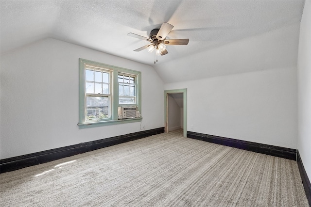 1818 Park Ave SE, Cedar Rapids, IA 52403 - bonus room featuring lofted ceiling, a ceiling fan, a textured ceiling, and carpet floors