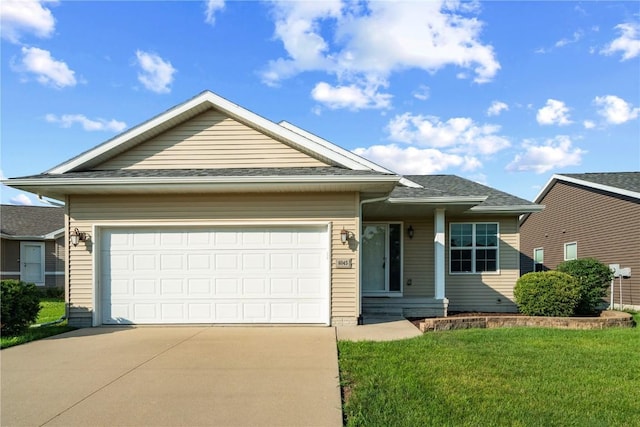 6045 Ridgewood Meadows Ln NE, Cedar Rapids, IA 52411 - ranch-style home with driveway, a garage, a front yard, and a shingled roof