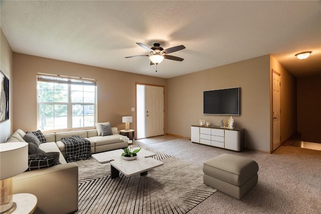 6045 Ridgewood Meadows Ln NE, Cedar Rapids, IA 52411 - living area featuring ceiling fan and light colored carpet