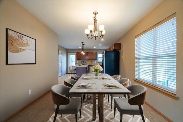 6045 Ridgewood Meadows Ln NE, Cedar Rapids, IA 52411 - dining space featuring a chandelier, healthy amount of natural light, and recessed lighting