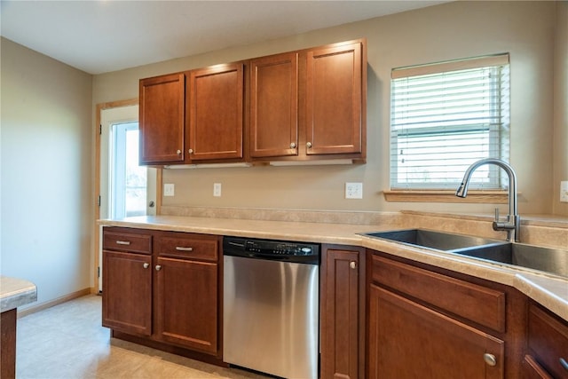 6045 Ridgewood Meadows Ln NE, Cedar Rapids, IA 52411 - kitchen with stainless steel dishwasher, light countertops, and brown cabinetry