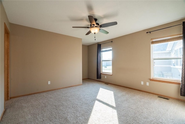 6045 Ridgewood Meadows Ln NE, Cedar Rapids, IA 52411 - carpeted spare room featuring baseboards and a ceiling fan