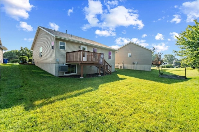 6045 Ridgewood Meadows Ln NE, Cedar Rapids, IA 52411 - back of property with a wooden deck, stairway, and a lawn