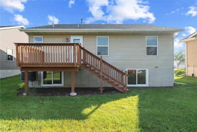 6045 Ridgewood Meadows Ln NE, Cedar Rapids, IA 52411 - rear view of property with a wooden deck, stairs, a yard, and brick siding