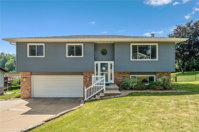 4185 Richland Dr, Cedar Rapids, IA 52405 - bi-level home featuring driveway, brick siding, a garage, and a front lawn