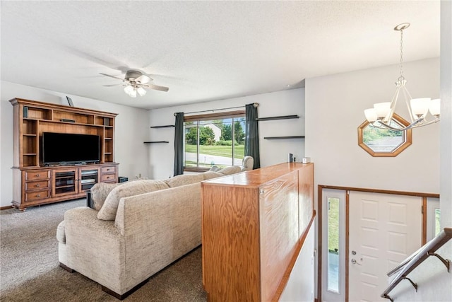 4185 Richland Dr, Cedar Rapids, IA 52405 - living area featuring carpet, a textured ceiling, a ceiling fan, and a chandelier