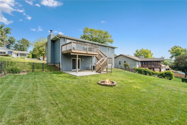 4185 Richland Dr, Cedar Rapids, IA 52405 - back of house with a fire pit, a wooden deck, stairway, a patio, and a chimney