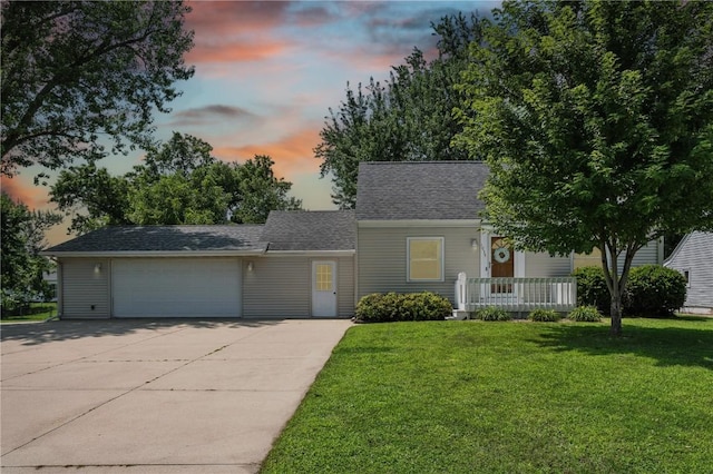 1039 27th St NE, Cedar Rapids, IA 52214 - view of front of home with driveway, a front yard, a shingled roof, and an attached garage