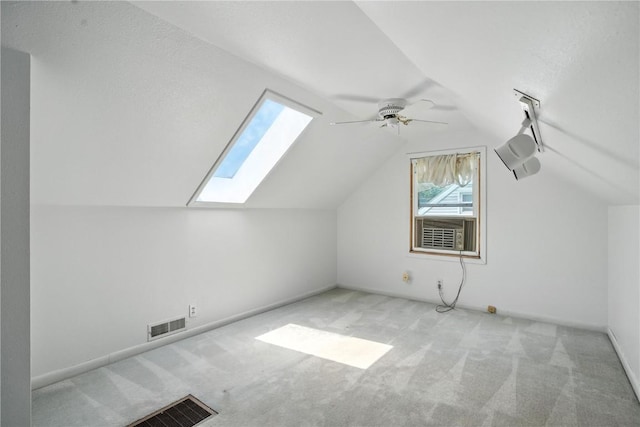1039 27th St NE, Cedar Rapids, IA 52214 - bonus room featuring a skylight, carpet flooring, vaulted ceiling, ceiling fan, and cooling unit