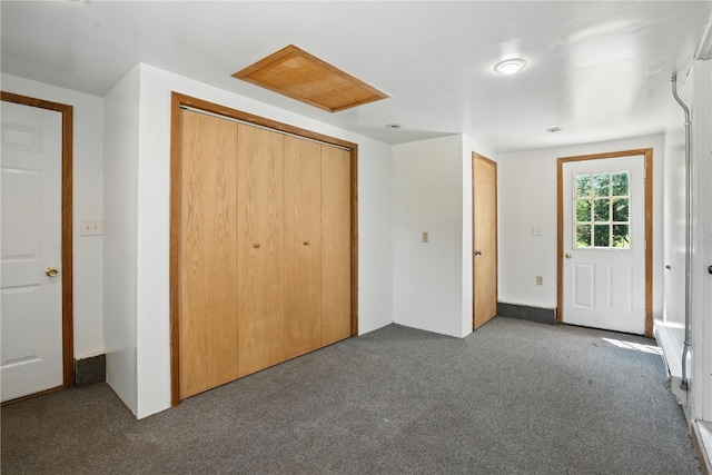 1039 27th St NE, Cedar Rapids, IA 52214 - unfurnished bedroom with carpet, a closet, and attic access