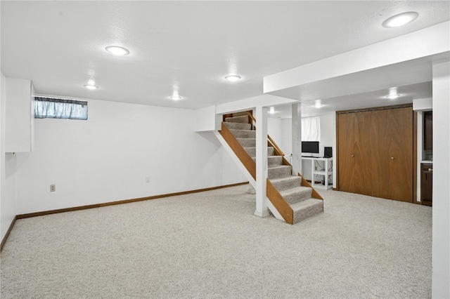 1039 27th St NE, Cedar Rapids, IA 52214 - basement with carpet flooring and stairway